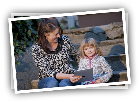Young girl and teacher playing Reading Raven