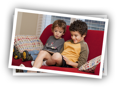 Two brothers playing Reading Raven on the iPad
